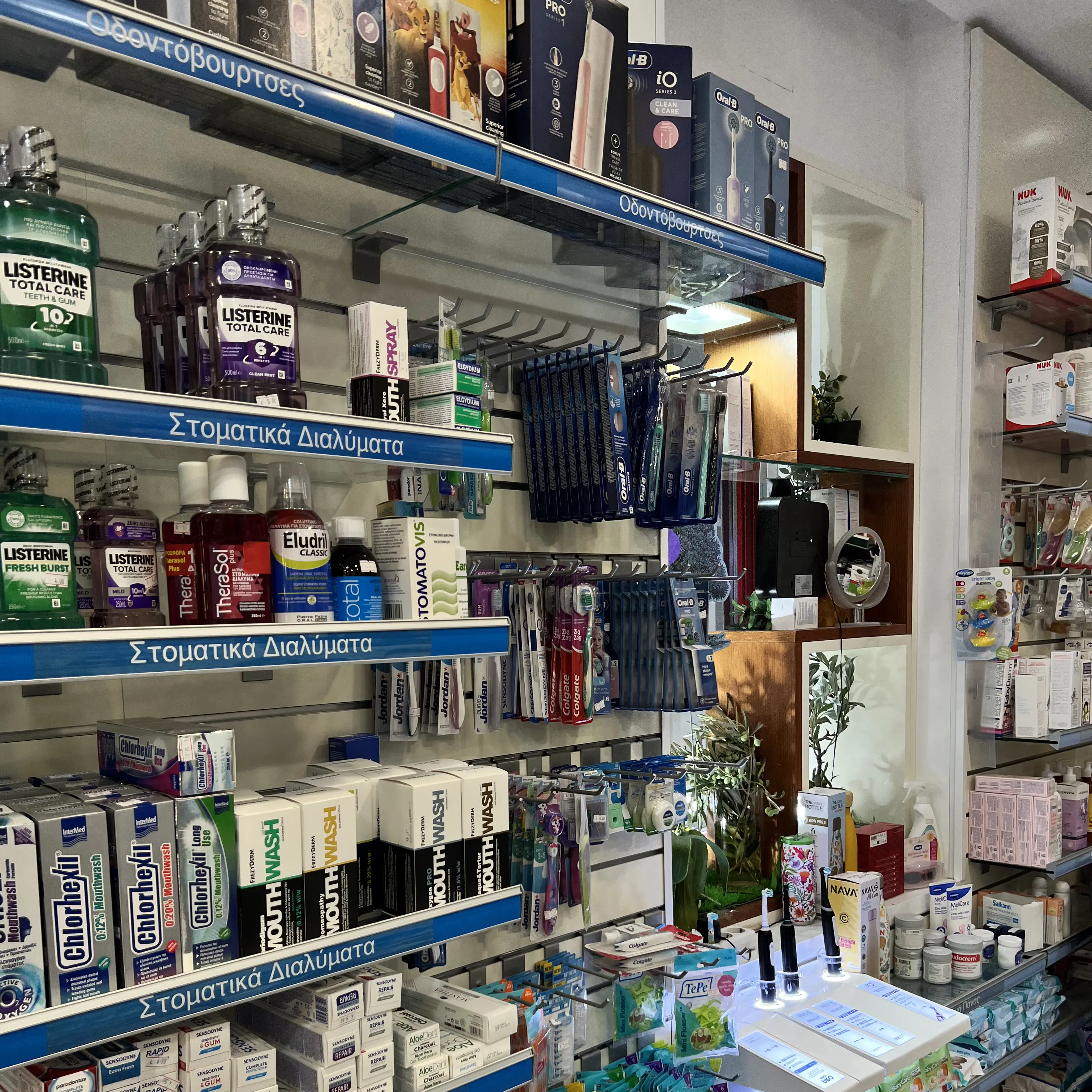 Pharmacist smiling behind the counter of the pharmacy
